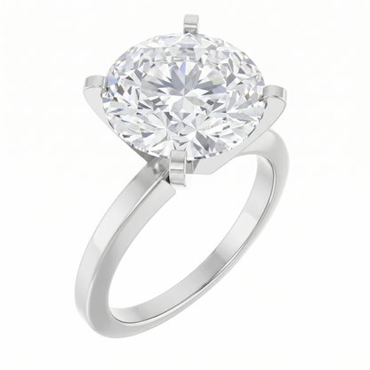 A silver ring with a large, round diamond set in the center.