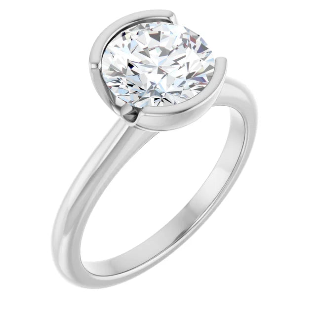 A silver engagement ring with a large, round diamond set in the center.