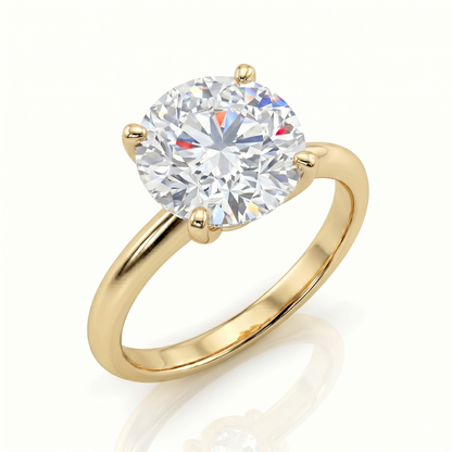 A gold engagement ring with a large, brilliant round diamond set in the center of the band.