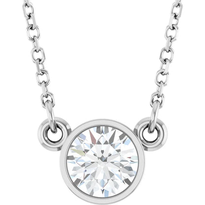 A silver necklace with a large, clear gemstone pendant.