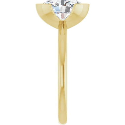 A gold ring with a large, clear diamond set in the center.