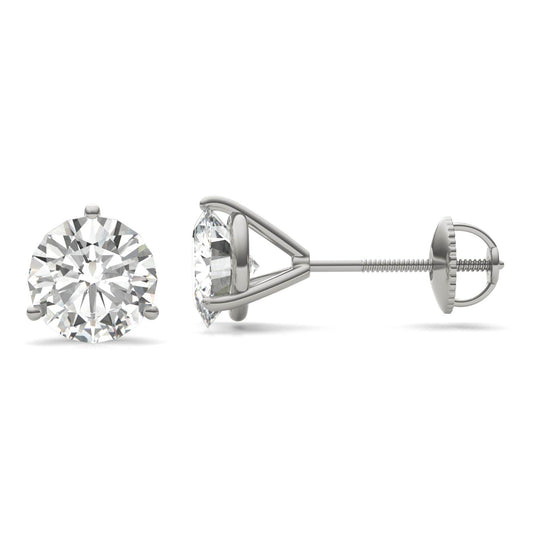 A pair of silver earrings with a large, clear diamond set in the center.