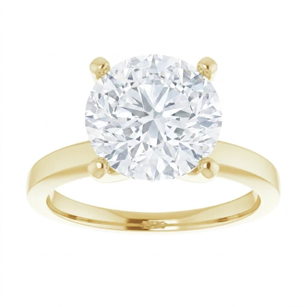 A gold engagement ring with a large, brilliant-cut diamond set in the center.