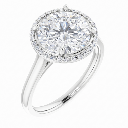 A beautiful diamond ring with a large, round brilliant cut diamond set in a halo of smaller diamonds.