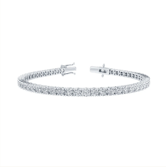 A silver bracelet with a row of small diamonds set in a repeating pattern.