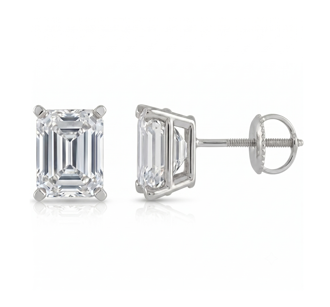A pair of elegant diamond earrings with a large, clear gemstone set in a silver metal frame.