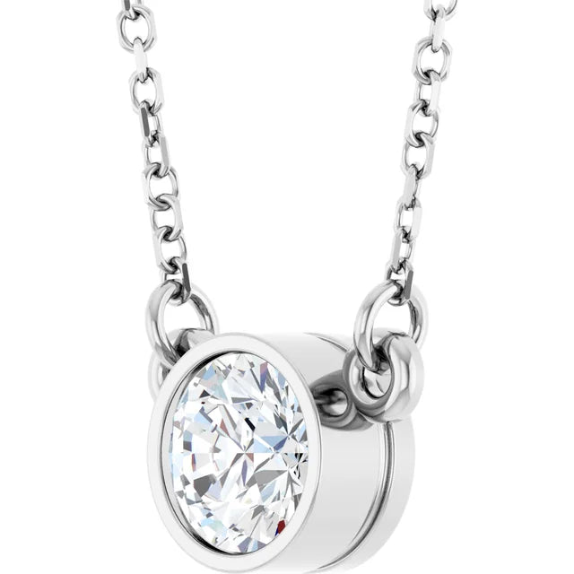 A silver necklace with a large, clear diamond pendant.