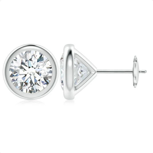 A pair of elegant silver earrings with a large, brilliant-cut diamond set in the center.