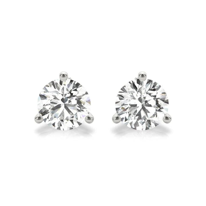A pair of diamond earrings with large, clear gemstones set in silver.