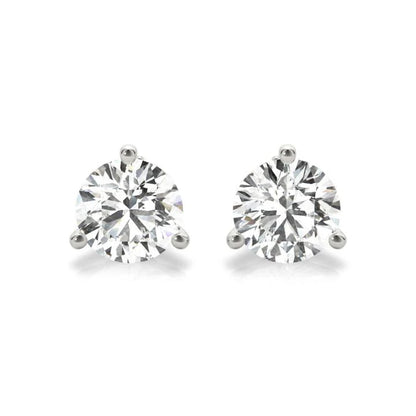 A pair of diamond earrings with large, clear gemstones set in silver.