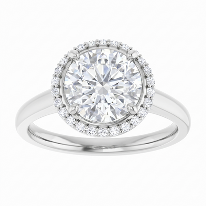 A silver ring with a large, brilliant-cut diamond at the center, surrounded by smaller diamonds.