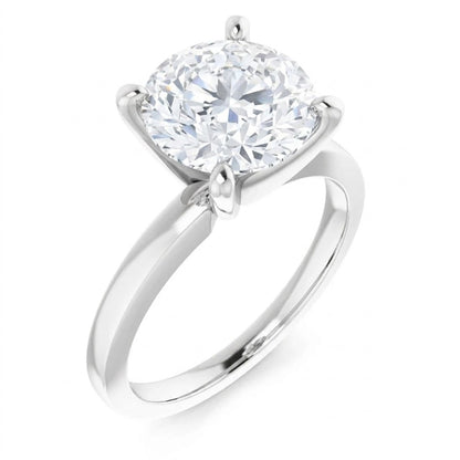 A silver engagement ring with a large, round diamond set in the center.