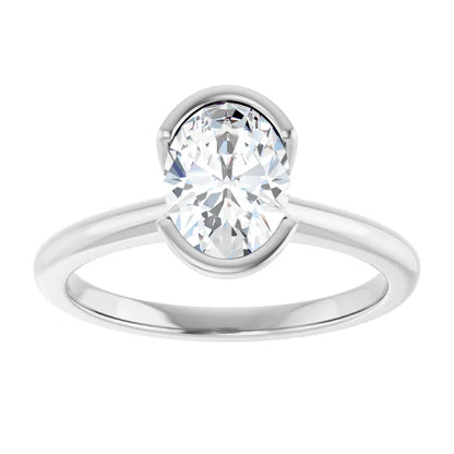 A silver engagement ring with a large, round diamond set in the center.