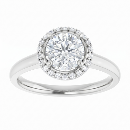 A silver engagement ring with a large, round diamond set in the center, surrounded by smaller diamonds.