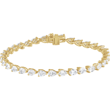 A gold bracelet with a row of small, clear diamonds set in the center.