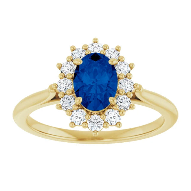 A gold ring with a large blue gemstone at the center, surrounded by smaller diamonds.