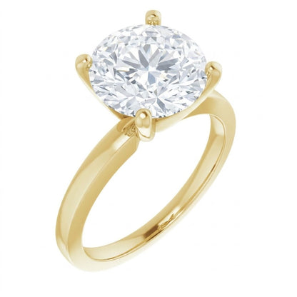 A gold engagement ring with a large, brilliant-cut diamond set in the center.