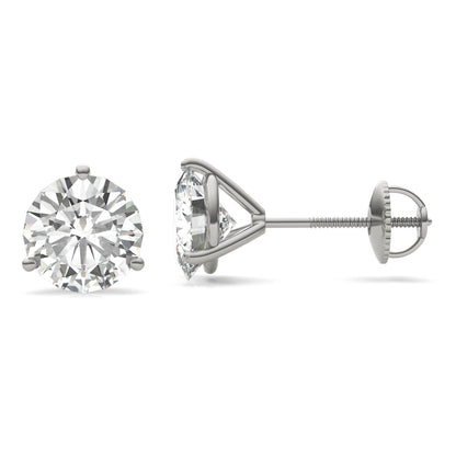 A pair of silver earrings with a large, clear diamond set in the center.