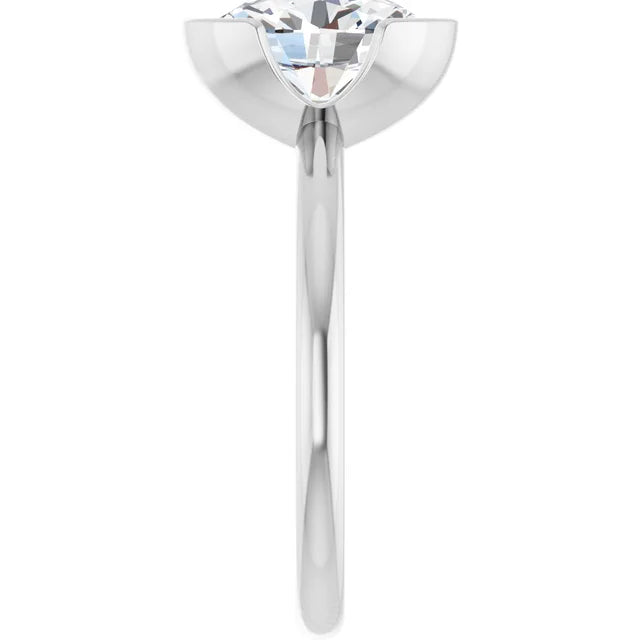 A close-up view of a silver ring with a large, clear diamond set in the center.