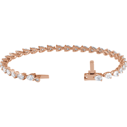 a beautiful rose gold bracelet with a row of small diamonds on it.
