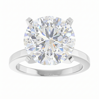 A large, brilliant round diamond engagement ring with a silver band.