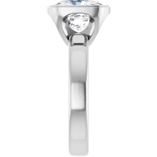 A silver ring with a large central diamond and a smaller diamond on either side.