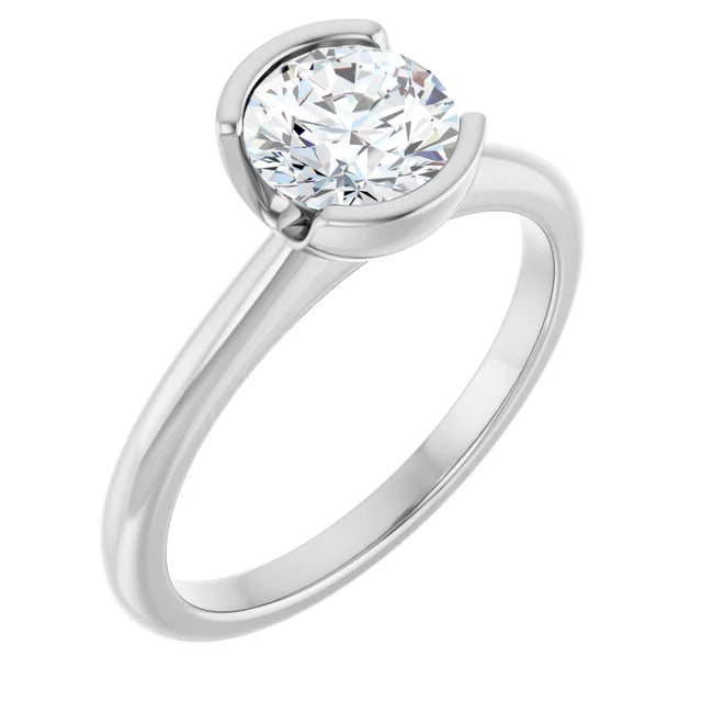 A silver engagement ring with a large, round diamond set in the center.
