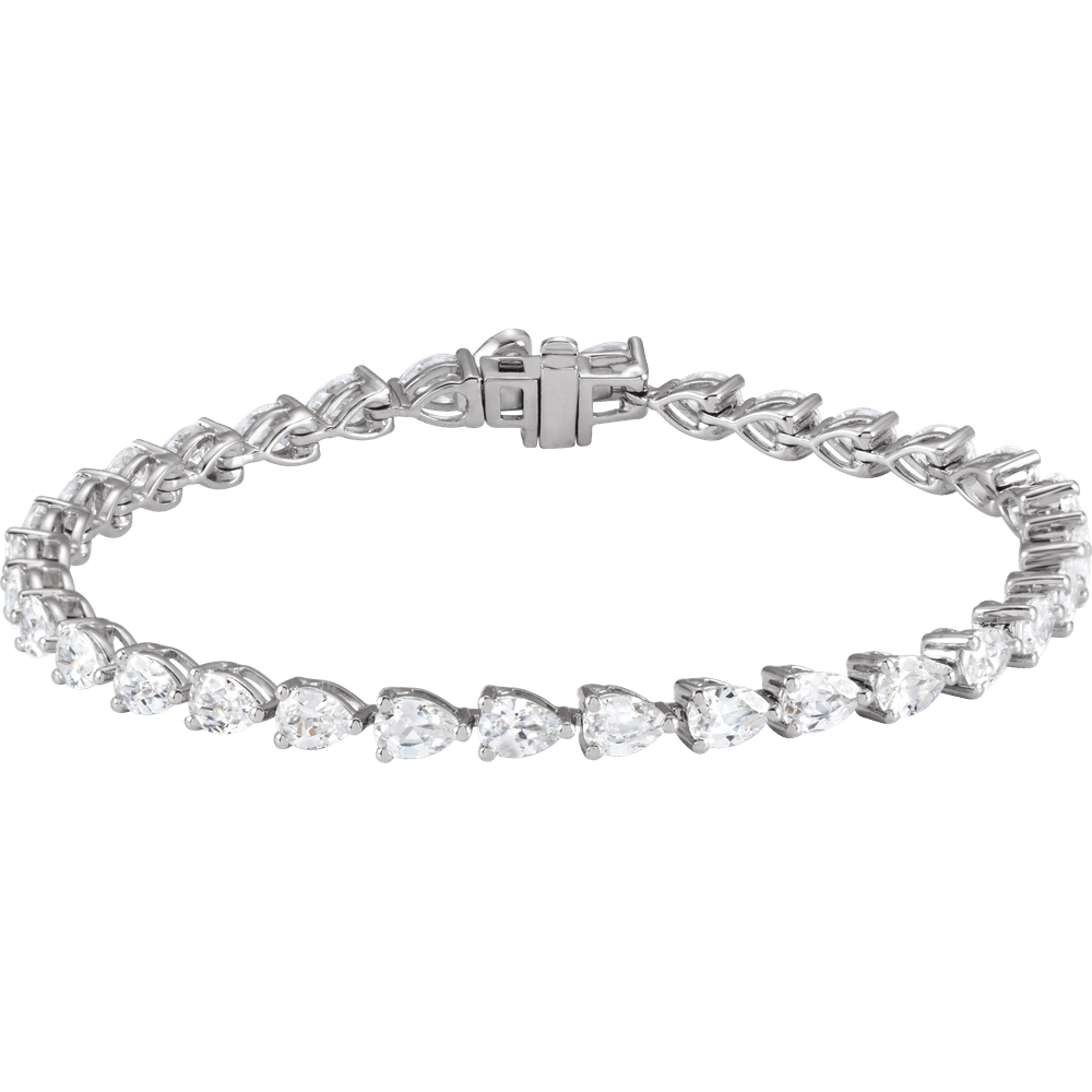 A silver bracelet with a row of small, clear diamonds set in a circular pattern.