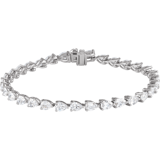 A silver bracelet with a row of small, clear diamonds set in a circular pattern.