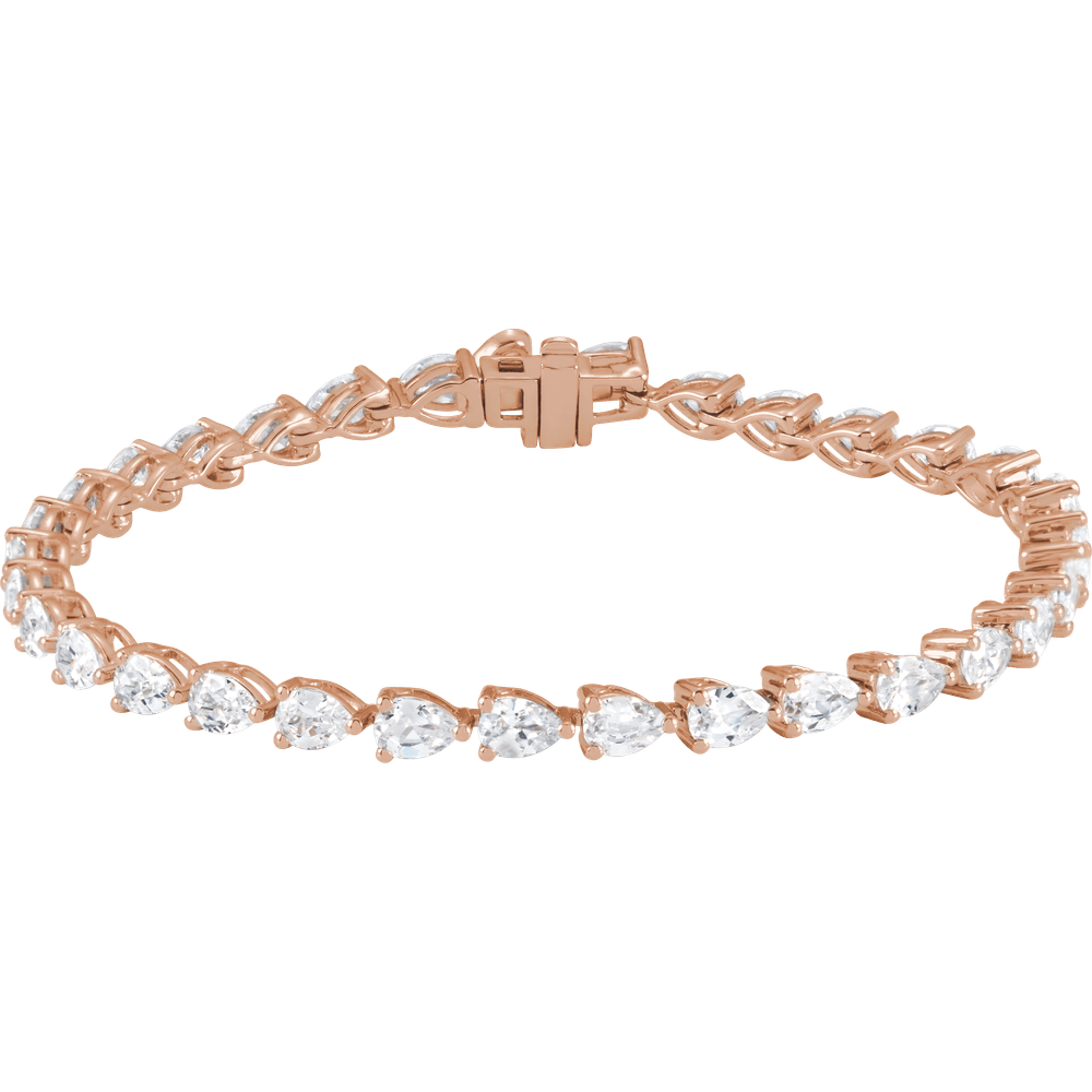 A rose gold bracelet adorned with numerous small, clear gemstones.