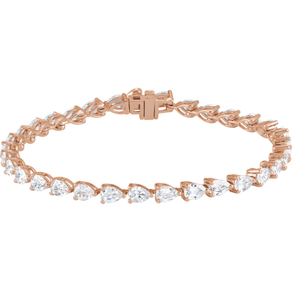 A rose gold bracelet adorned with numerous small, clear gemstones.