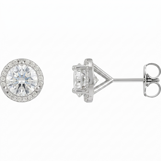 A pair of elegant silver earrings with a large, round diamond set in the center, surrounded by smaller diamonds.