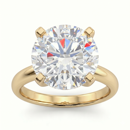 A gold ring with a large, brilliant round diamond set in the center.