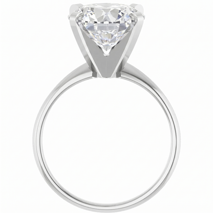 A large, clear diamond engagement ring with a prominent center stone.