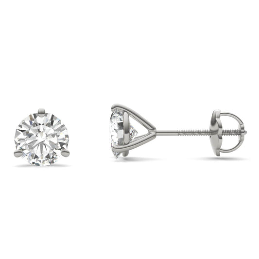 A pair of silver earrings with a large, clear diamond set in the center.
