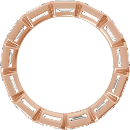 a ring with a unique design, featuring a series of small, rectangular-shaped stones or diamonds arranged in a circular pattern.