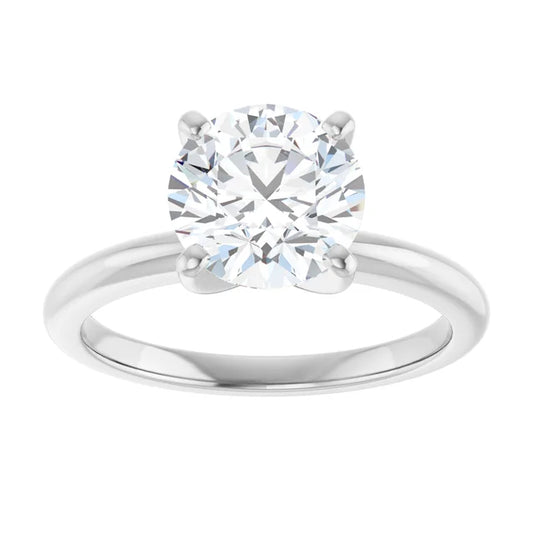 A close-up of a diamond engagement ring with a large, brilliant-cut diamond set in a silver band.