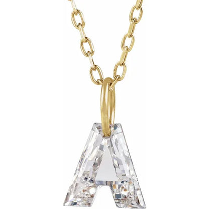 A gold-colored necklace with a large crystal letter "A" pendant.
