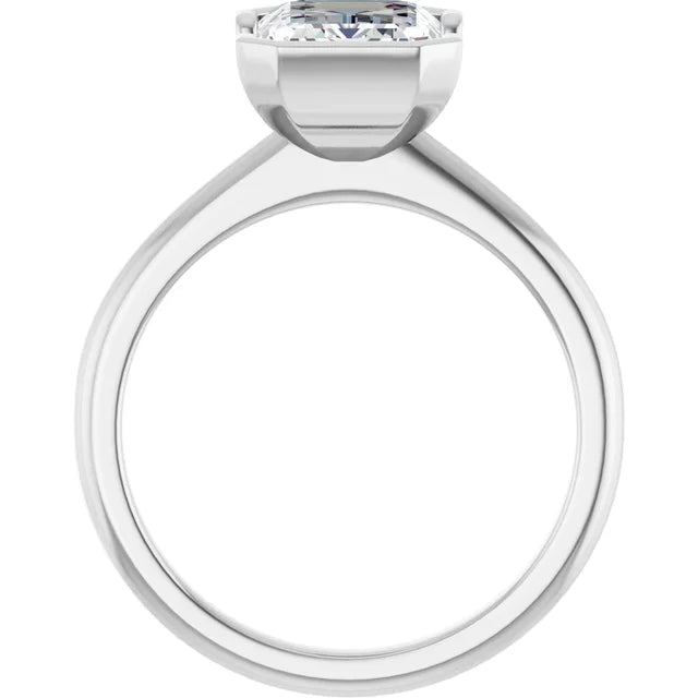 A silver engagement ring with a large diamond set in the center.