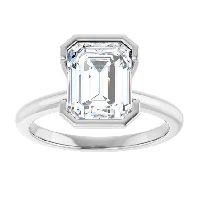 A silver engagement ring with a large, clear diamond set in the center.