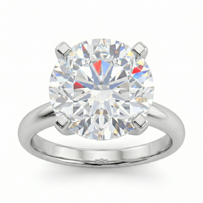 A large, brilliant diamond engagement ring with a silver band.
