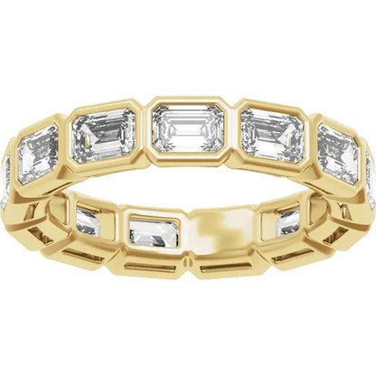 A gold ring with a row of diamond-encrusted gemstones.
