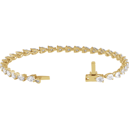 A gold bracelet with a row of small diamonds on it.