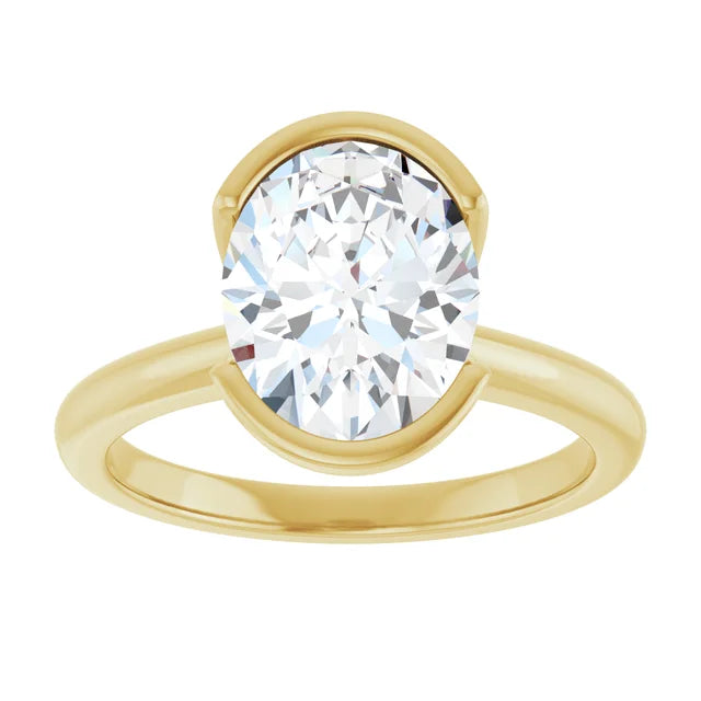 A gold ring with a large, round diamond set in the center.