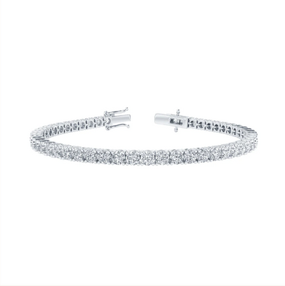 A silver bracelet with a row of small diamonds set in a repeating pattern.