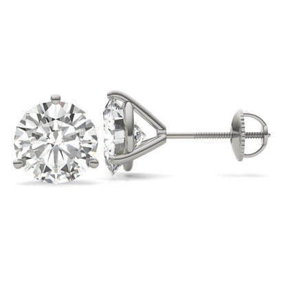 A pair of silver earrings with a large, clear diamond set in the center.