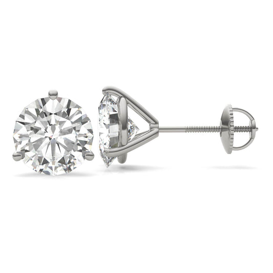 A pair of silver earrings with a large, clear diamond set in the center.