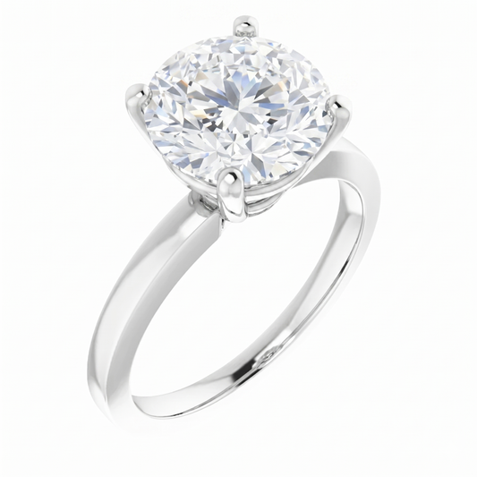 A silver engagement ring with a large, round diamond set in the center.